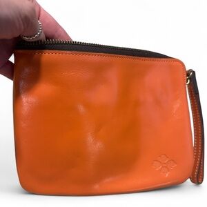 Gorgeous Patricia Nash orange Leather clutch wristlet with tan suede interior